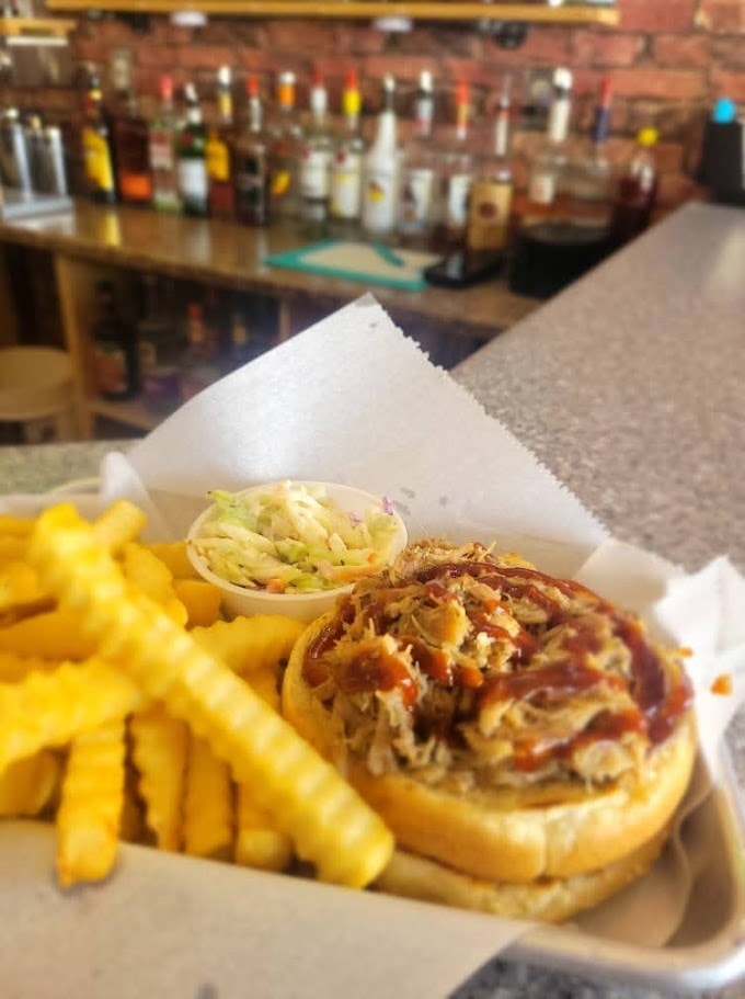 Pulled pork sandwich with fries and coleslaw